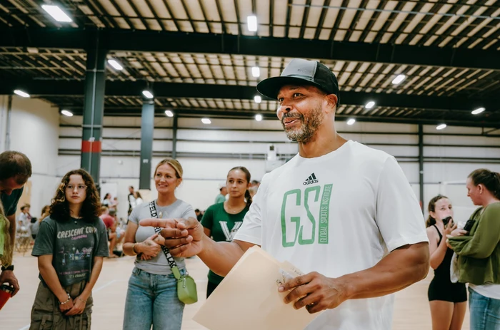 GSI coach guiding athletes and families during a volleyball session